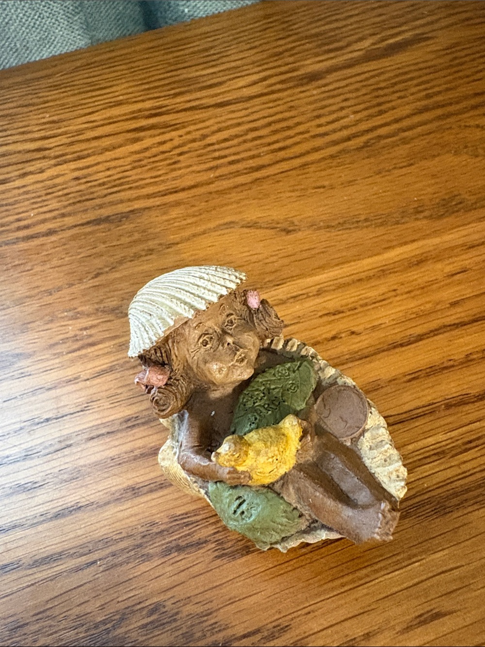 Brown Fairy Sculpture with Yellow Bird and Cream Shell Hat